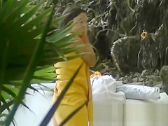 This beautiful nudist woman was sunbathing on a nude beach