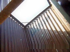 The girl dresses up in a beach cabin