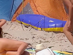 two nude girls on beach