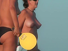 Nudist beach voyeur vid with a hot brunette