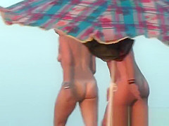 Nudist beach voyeur vid with a hot brunette