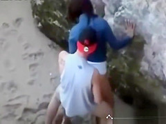 Teens doggy style on the beach