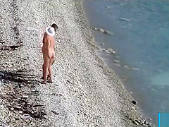 Couple fucked on a public beach while as people walked near