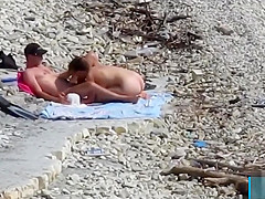 Couple fucked on a public beach while as people walked near
