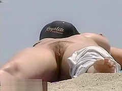 Busty nude beach babes filmed by a voyeur
