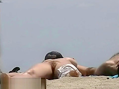 Busty nude beach babes filmed by a voyeur