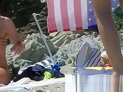 Some teen and mature couples resting at the nudist beach