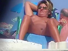 Naked hotties followed around by a nude beach voyeur