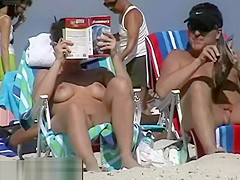 Couple split by Strangers on a nude beach