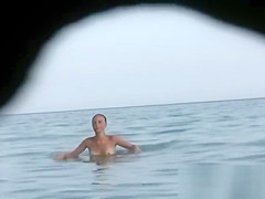 Naked and showing everything at the nude beach