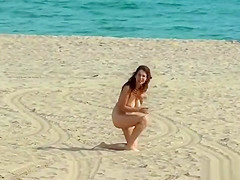 Redhead made walking naked on the beach