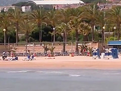 Tied up busty Spanish blonde on the beach