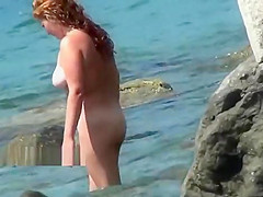 Nudist girls expose bodies at the beach