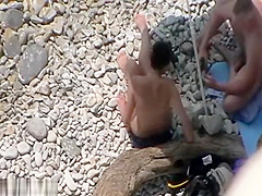 Swingers having threesome at a nude beach caught