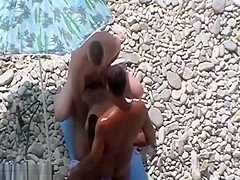 Swingers having threesome at a nude beach caught