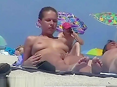 Nude beach spy camera with a sexy couple in focus
