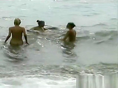 3 Les girls on a nude beach