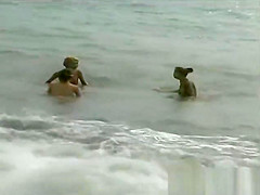 3 Les girls on a nude beach