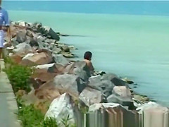 blonde peeing on the beach