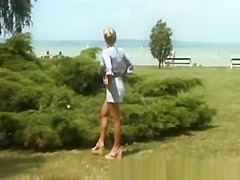 blonde peeing on the beach
