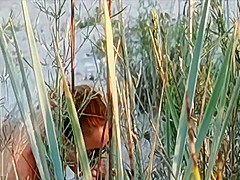 Amateur couple got caught having sex on the beach by voyeur.