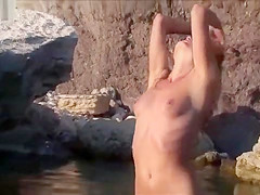 Hot Teen Naked at The Beach in The Sea Spreading Legs to Show Her Shaved Pussy