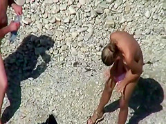 Beach couple sex in the sea