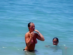 Huge natural tits on the topless beach