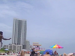 EXHIBITIONIST WIFE #100- HEATHER TAKES HER HUBBY HER GIRLFRIEND TO THE NUDE BEACH! GOOD VOYEUR BAD VOYEUR!!!