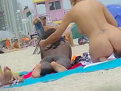 EXHIBITIONIST WIFE #100- HEATHER TAKES HER HUBBY HER GIRLFRIEND TO THE NUDE BEACH! GOOD VOYEUR BAD VOYEUR!!!