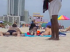 EXHIBITIONIST WIFE #100- HEATHER TAKES HER HUBBY HER GIRLFRIEND TO THE NUDE BEACH! GOOD VOYEUR BAD VOYEUR!!!