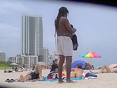 EXHIBITIONIST WIFE #100- HEATHER TAKES HER HUBBY HER GIRLFRIEND TO THE NUDE BEACH! GOOD VOYEUR BAD VOYEUR!!!