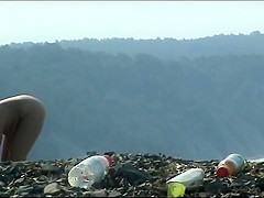Mature woman with a big ass on a nudist beach