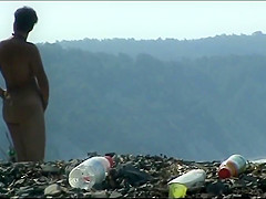 Mature woman with a big ass on a nudist beach