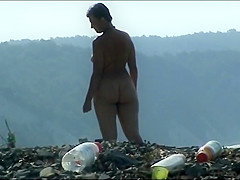 Mature woman with a big ass on a nudist beach