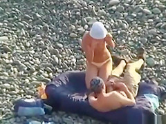 Voyeur on public beach. Oral sex