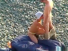 Voyeur on public beach. Oral sex