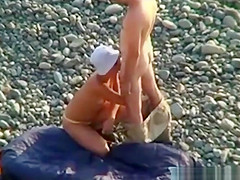 Voyeur on public beach. Oral sex