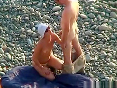 Voyeur on public beach. Oral sex