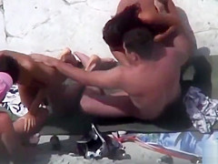 Public foursome at the nude beach