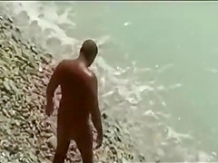 Threesome sex fun on public beach caught on voyeur cam