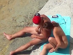 Beach couple sex play