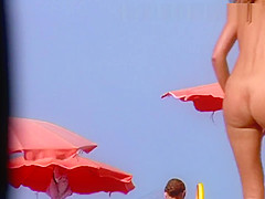 Busty MILF mom fully naked on the beach!