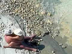 Mature nudist couple caught fucking at the beach