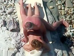 Mature nudist couple caught fucking at the beach