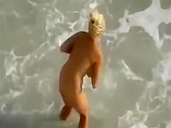 Naked babe on the beach enjoys hard cock of her lover