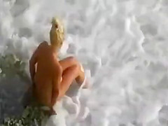 Naked babe on the beach enjoys hard cock of her lover