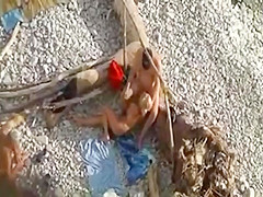 Naked babe on the beach enjoys hard cock of her lover