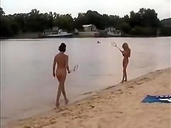 Nude girls outdoor on public beach having fun