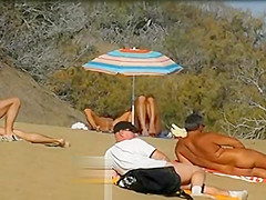 Slutwife masturbating for pervs in a beach